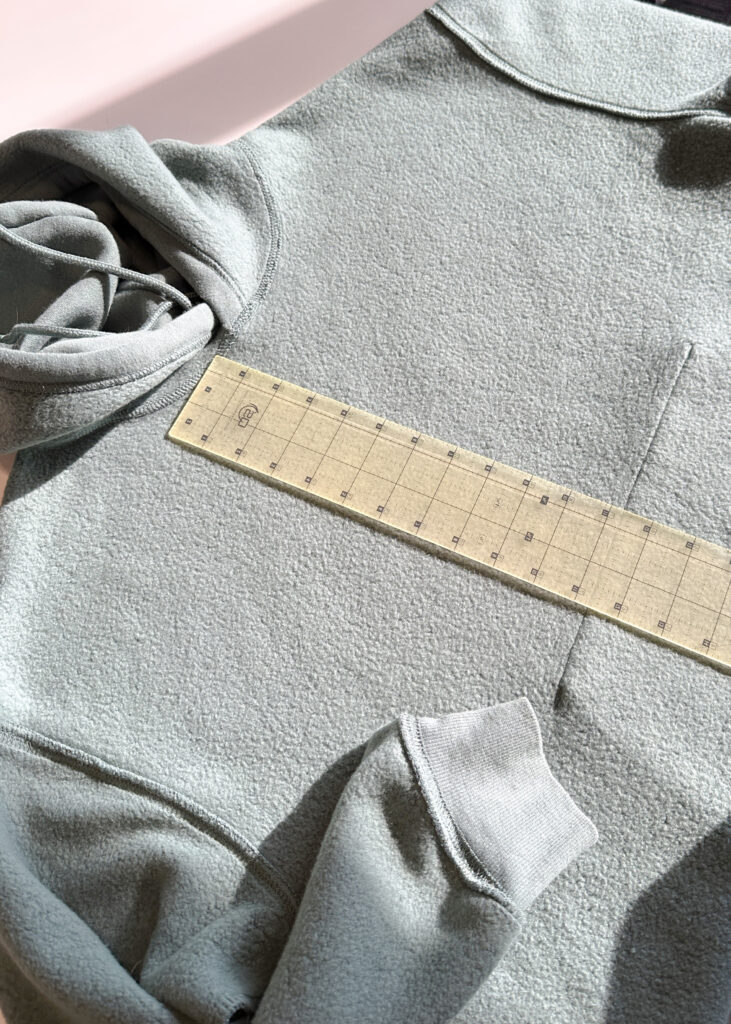 Plain hoodie before reverse applique with center mark line drawn
