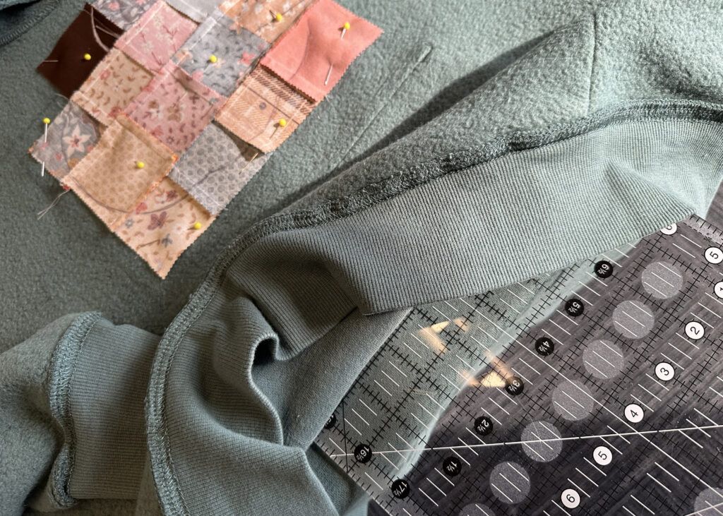 Hard surface placed inside the hoodie to make pinning easier for applique project