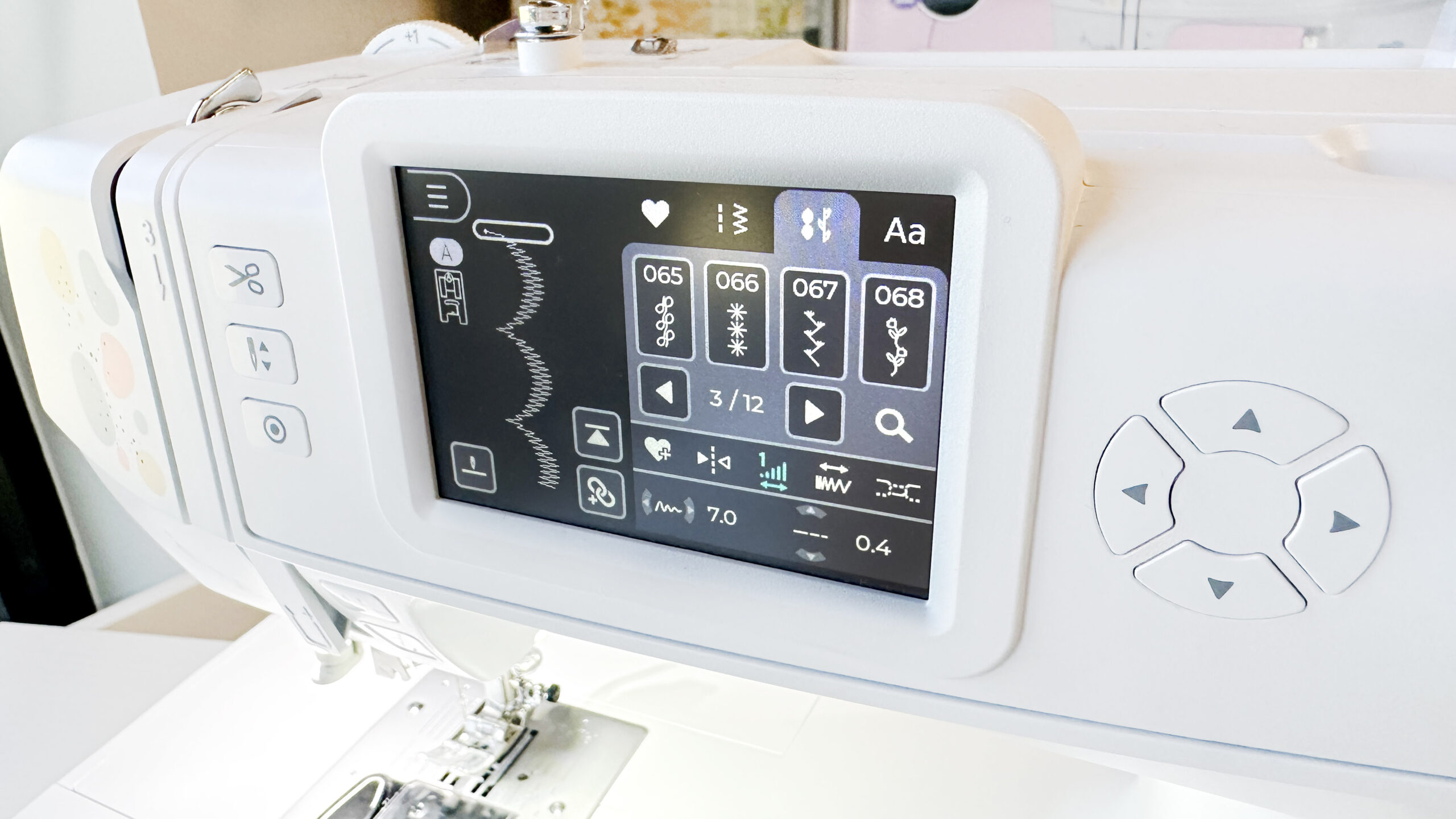 Decorative stitches on the NE210 color touch screen display